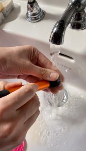 Washing makeup brushes using soap and water