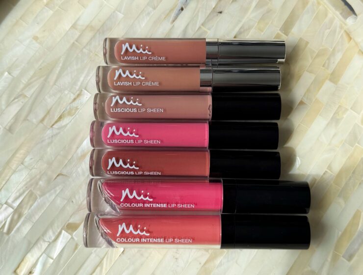 Mii Cosmetics Lip Gloss lined up ready to swatch. A range of shades from nude lip gloss to bright pink lip gloss