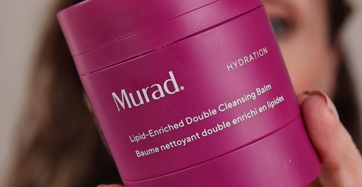 Murad Lipid-Enriched Double Cleansing Balm Review. Amy hold the vibrant pink tub