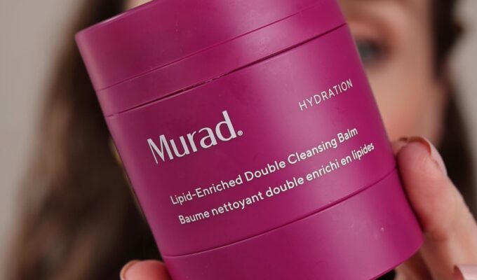 Murad Lipid-Enriched Double Cleansing Balm Review. Amy hold the vibrant pink tub