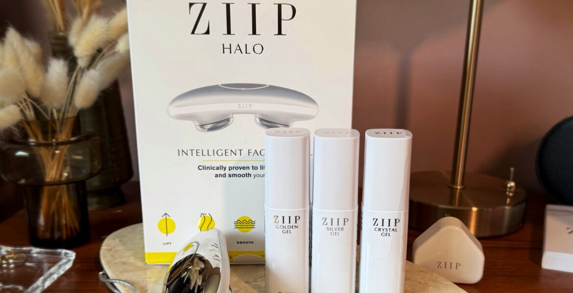 ZIIP HALO beauty device review. The microcurrent device stands on a wooden beauty vanity