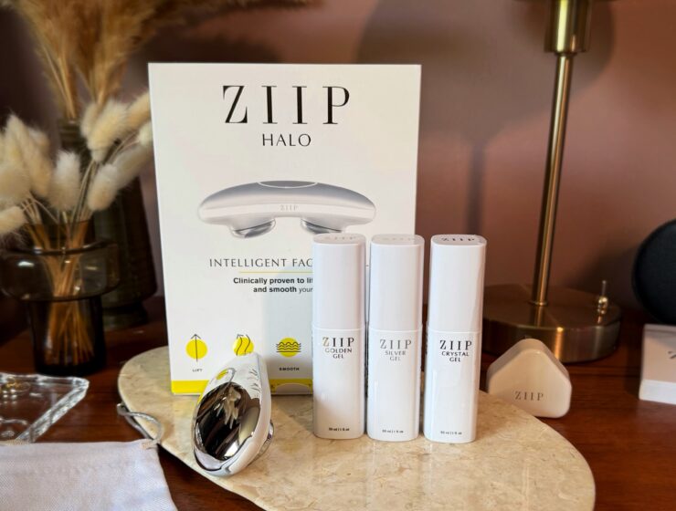 ZIIP HALO beauty device review. The microcurrent device stands on a wooden beauty vanity